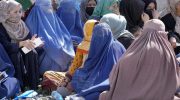 Afghan women wait to receive food rations distributed by a Saudi humanitarian aid group, in Kabul, Afghanistan, Monday, April 25, 2022. Afghanistan’s Taliban rulers on Saturday, May 7,  ordered all Afghan women to wear head-to-toe clothing in public, a sharp hard-line pivot that confirmed the worst fears of rights activists and was bound to further complicate Taliban dealings with an already distrustful international community. (AP Photo/Ebrahim Noroozi)