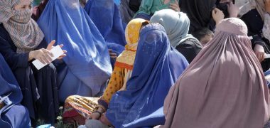 Afghan women wait to receive food rations distributed by a Saudi humanitarian aid group, in Kabul, Afghanistan, Monday, April 25, 2022. Afghanistan’s Taliban rulers on Saturday, May 7,  ordered all Afghan women to wear head-to-toe clothing in public, a sharp hard-line pivot that confirmed the worst fears of rights activists and was bound to further complicate Taliban dealings with an already distrustful international community. (AP Photo/Ebrahim Noroozi)